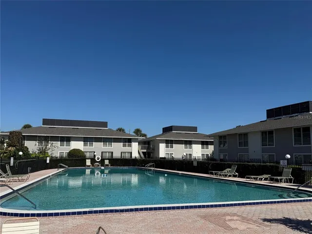 a view of pool with outdoor seating