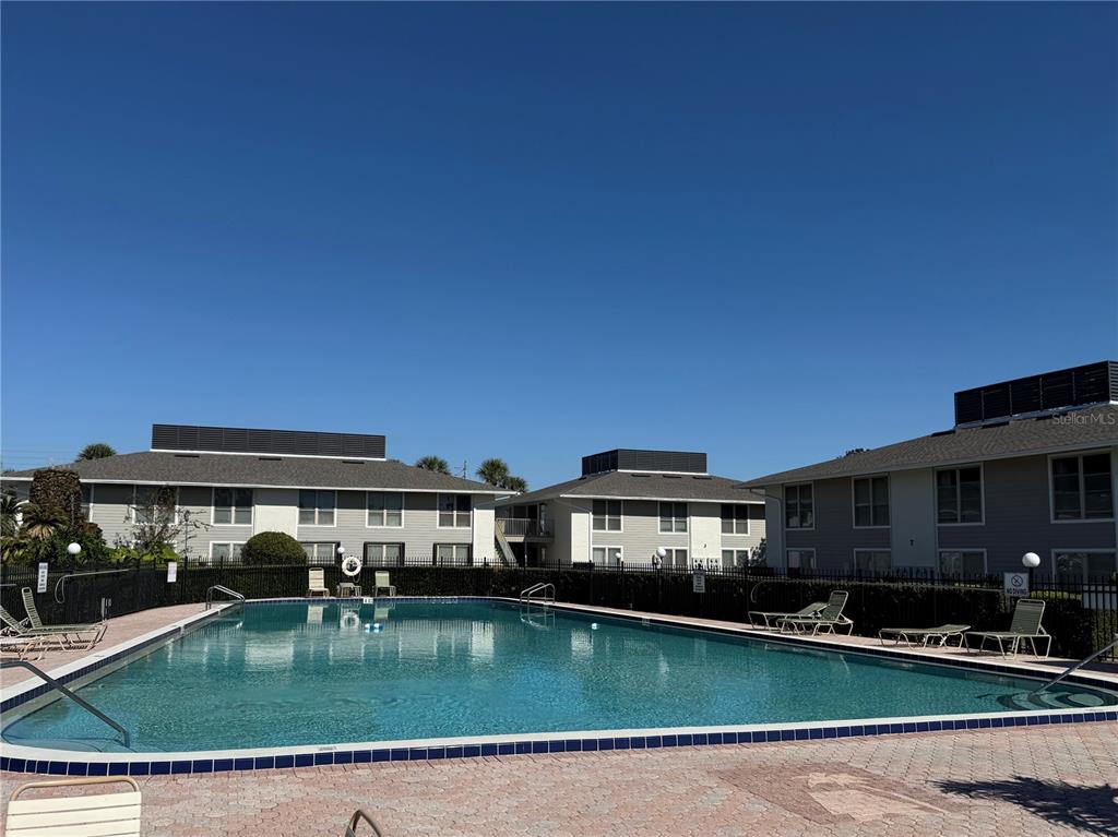 1935 South Conway Road, Unit 6 Orlando, FL 32812 - Photo 23 of 25 a view of pool with outdoor seating