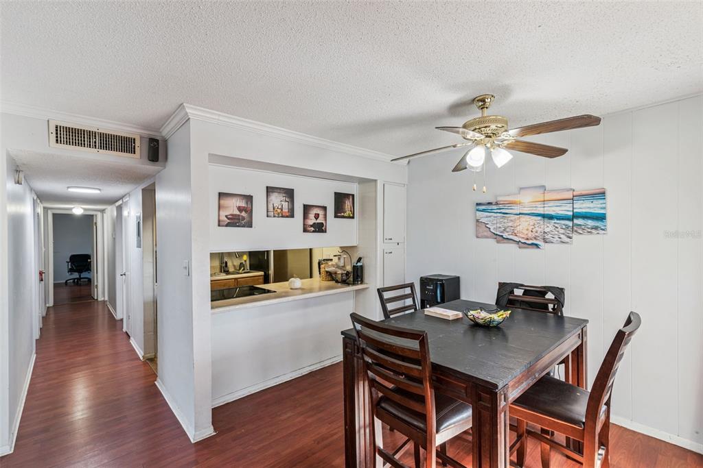 1935 South Conway Road, Unit 6 Orlando, FL 32812 - Photo 3 of 25 a view of a dining room with furniture and wooden floor