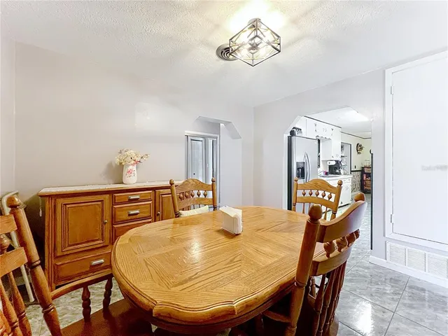 a kitchen with kitchen island granite countertop lots of counter top space and cabinets