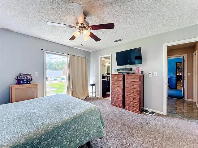 a en suite bathroom with a sink double vanity and a mirror