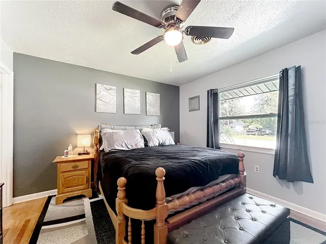 a bedroom with furniture and a window