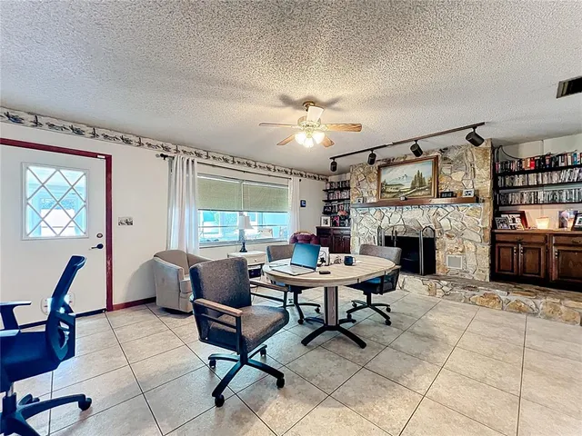 a view of a livingroom with furniture and a window