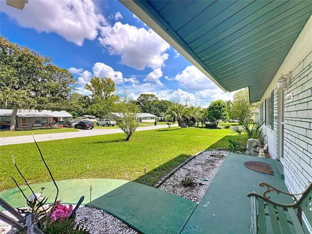 a view of a street with sitting area