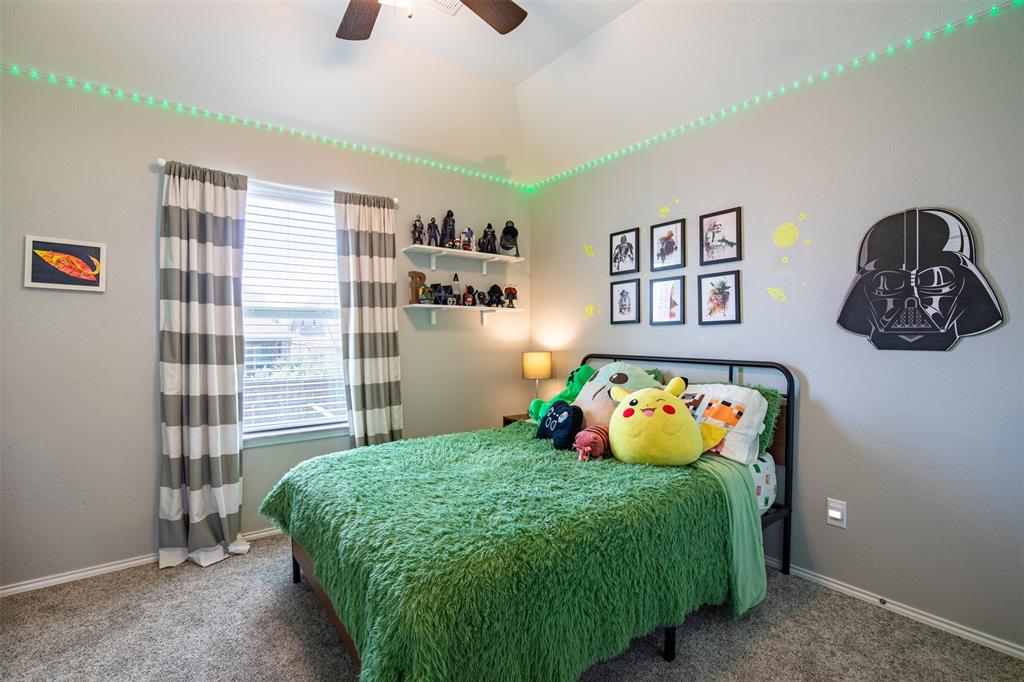 416 Allbright Road Celina, TX 75009 - Photo 27 of 40 a bedroom with a bed and a window