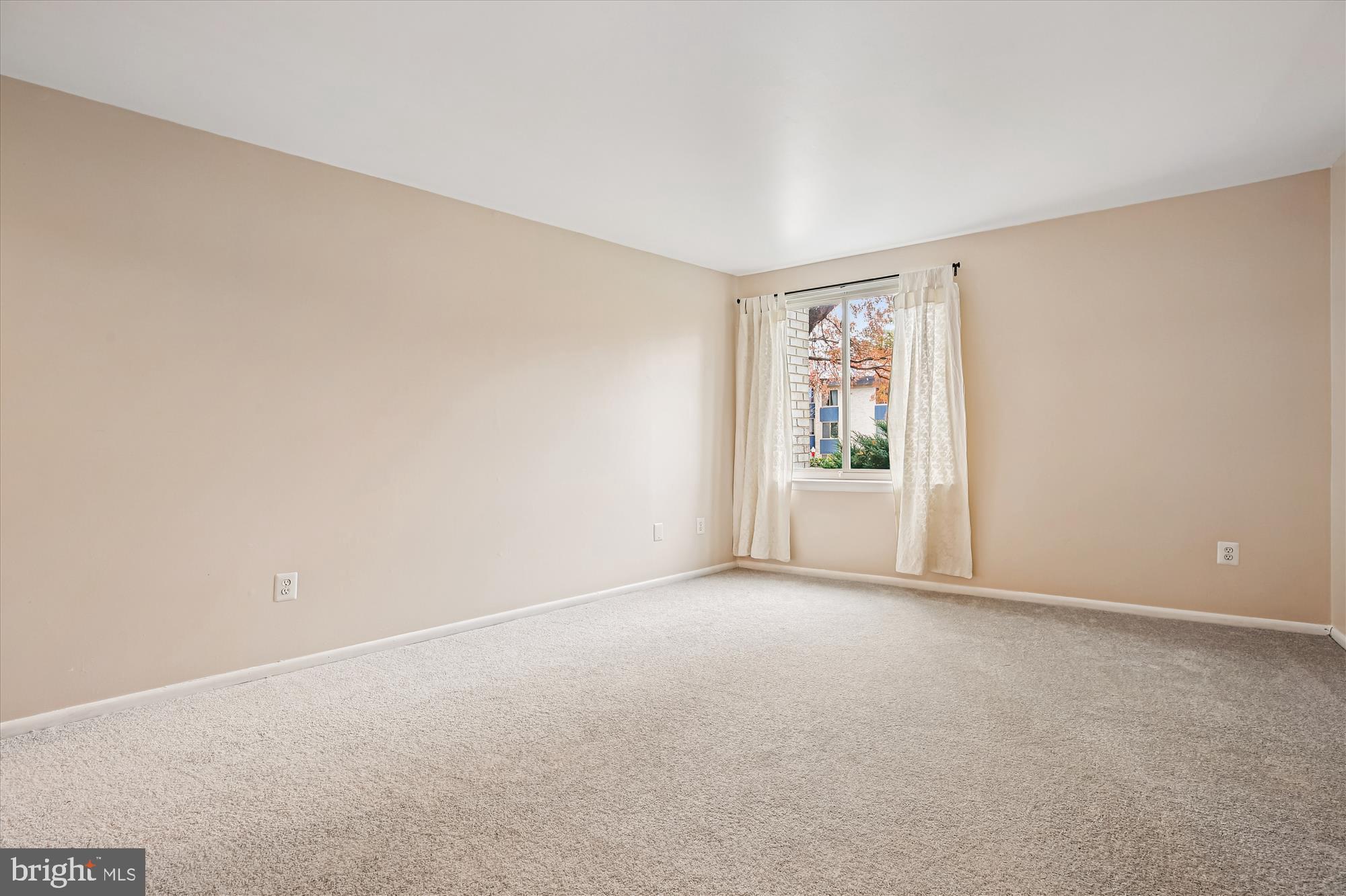 2517 Baltimore Road, Unit 25171 Rockville, MD 20853 - Photo 13 of 35 a view of an empty room with a window