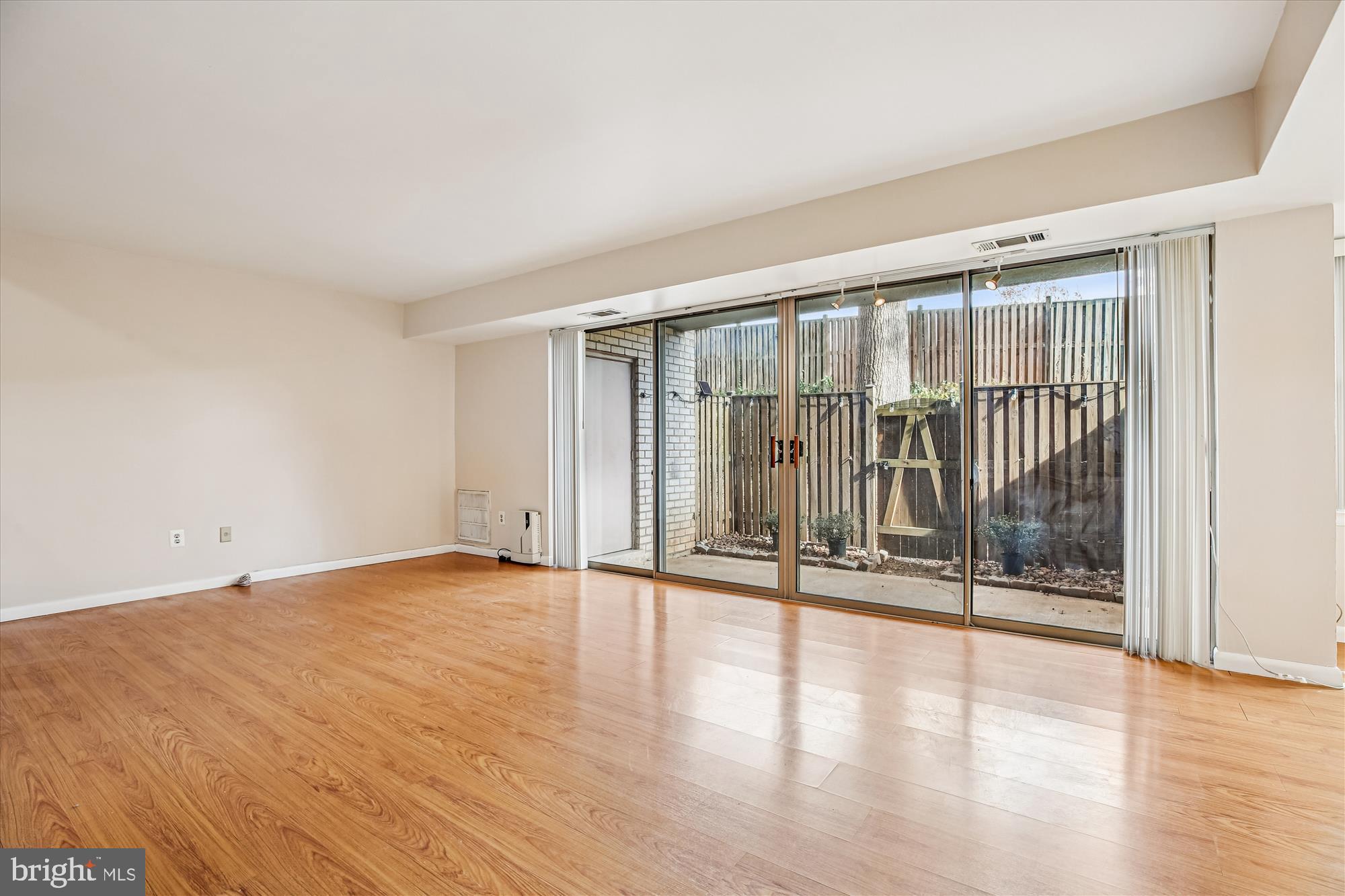 2517 Baltimore Road, Unit 25171 Rockville, MD 20853 - Photo 7 of 35 a view of an empty room with wooden floor