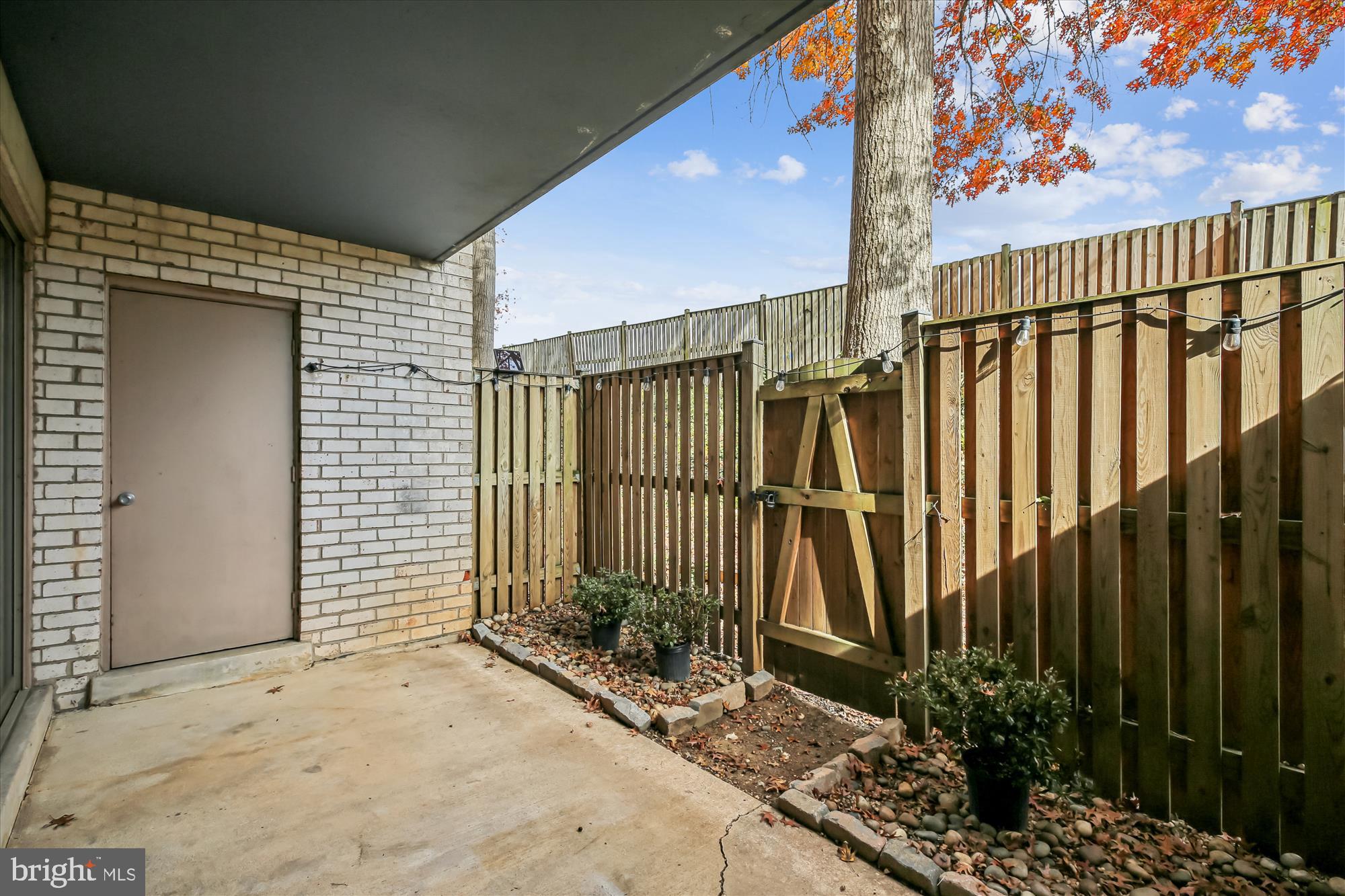 2517 Baltimore Road, Unit 25171 Rockville, MD 20853 - Photo 9 of 35 a view of a house with a wooden fence