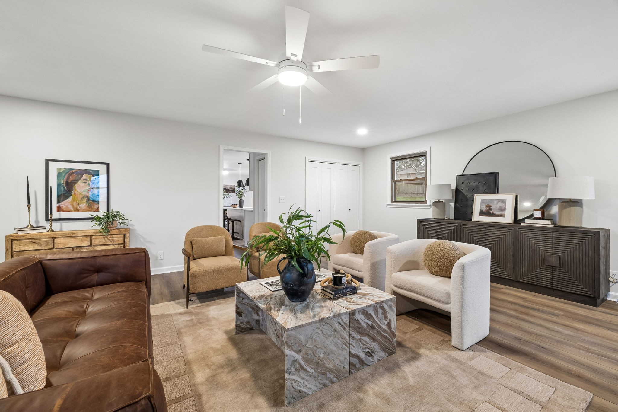 171 New Shackle Island Road Hendersonville, TN 37075 - Photo 12 of 48 a living room with furniture a rug kitchen view and a potted plant