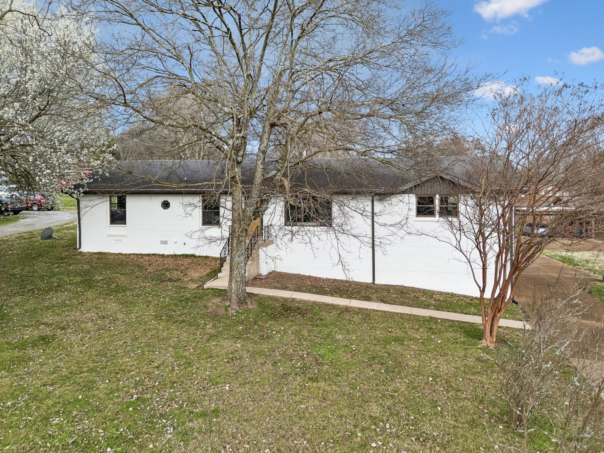 171 New Shackle Island Road Hendersonville, TN 37075 - Photo 45 of 48 a front view of a house with a yard and garage