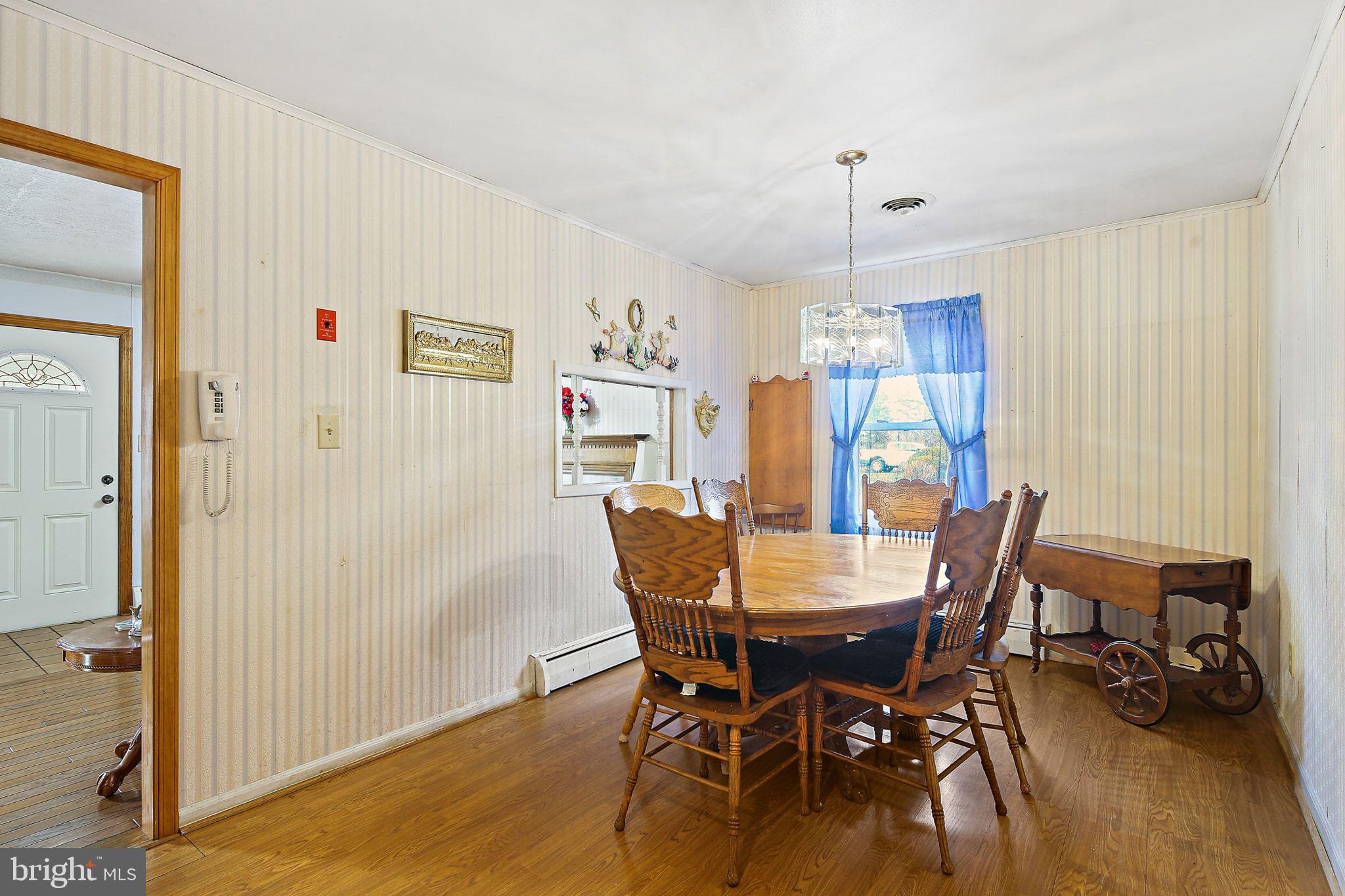 1025 St Michaels Road Mount Airy, MD 21771 - Photo 11 of 31 a dining room with furniture window and wooden floor