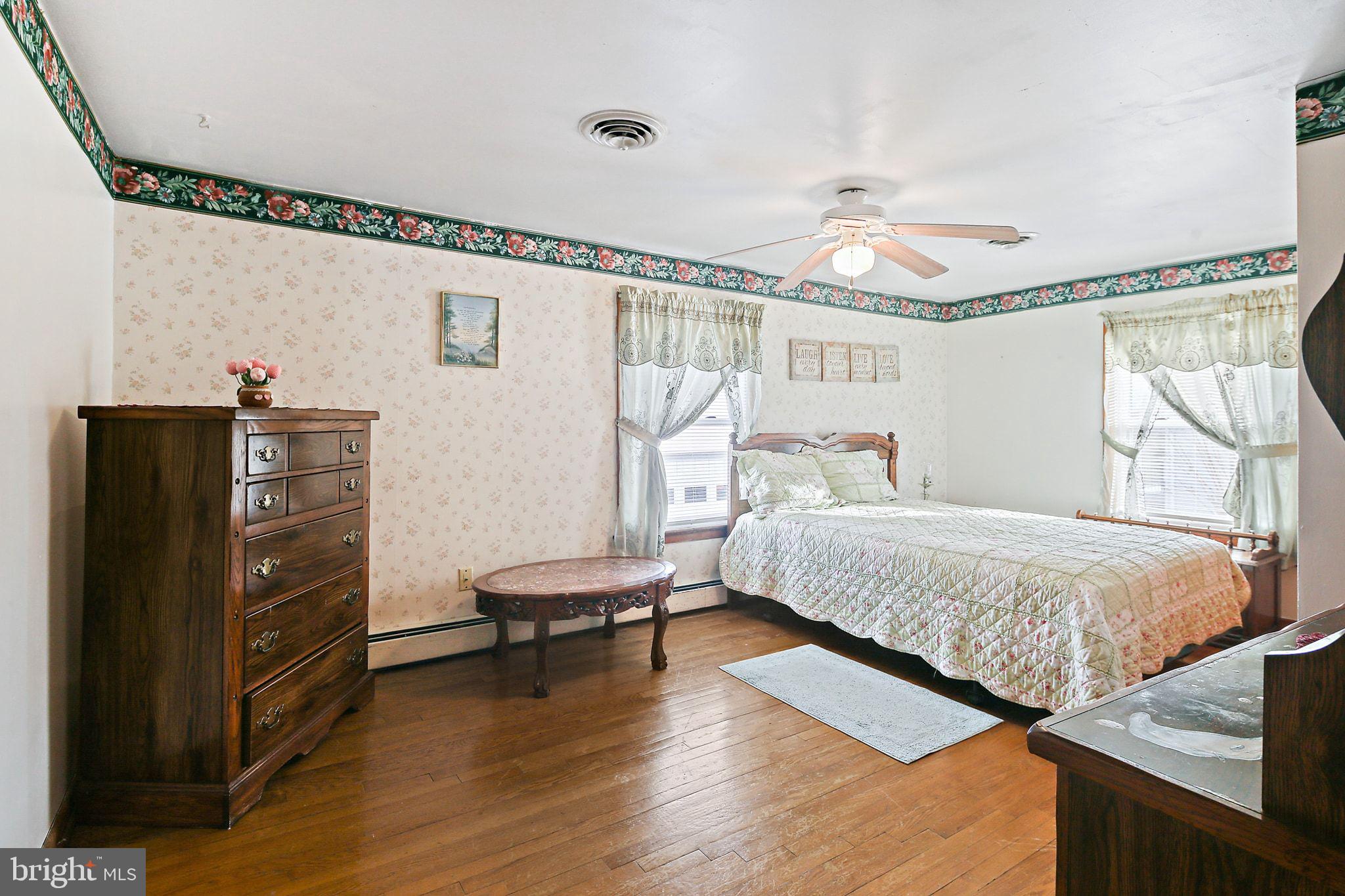1025 St Michaels Road Mount Airy, MD 21771 - Photo 18 of 31 a bedroom with bed and wooden floor