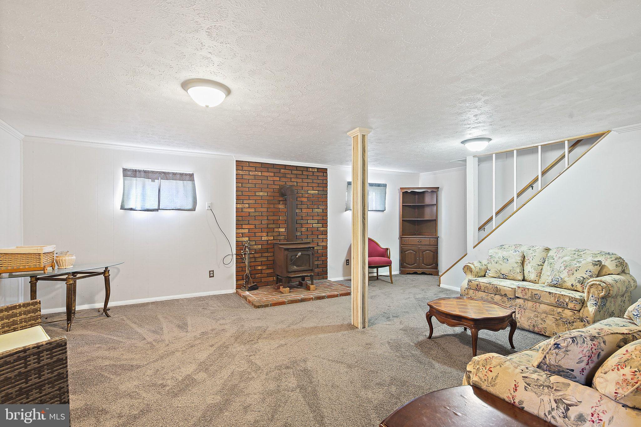 1025 St Michaels Road Mount Airy, MD 21771 - Photo 23 of 31 a living room with furniture and stairs