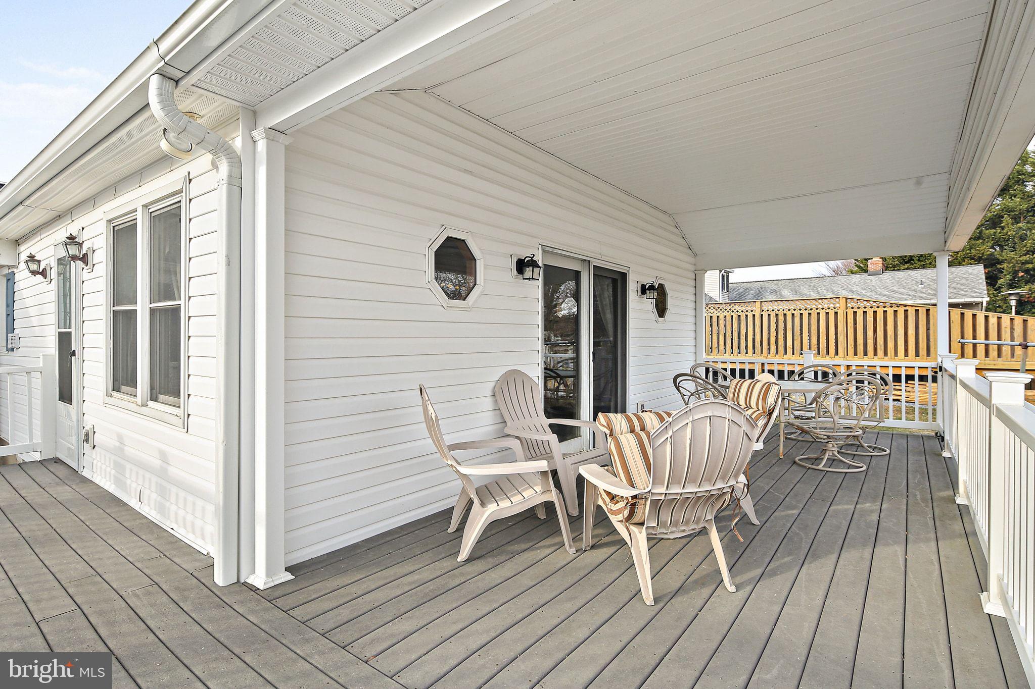1025 St Michaels Road Mount Airy, MD 21771 - Photo 26 of 31 a view of a wooden chairs on the deck