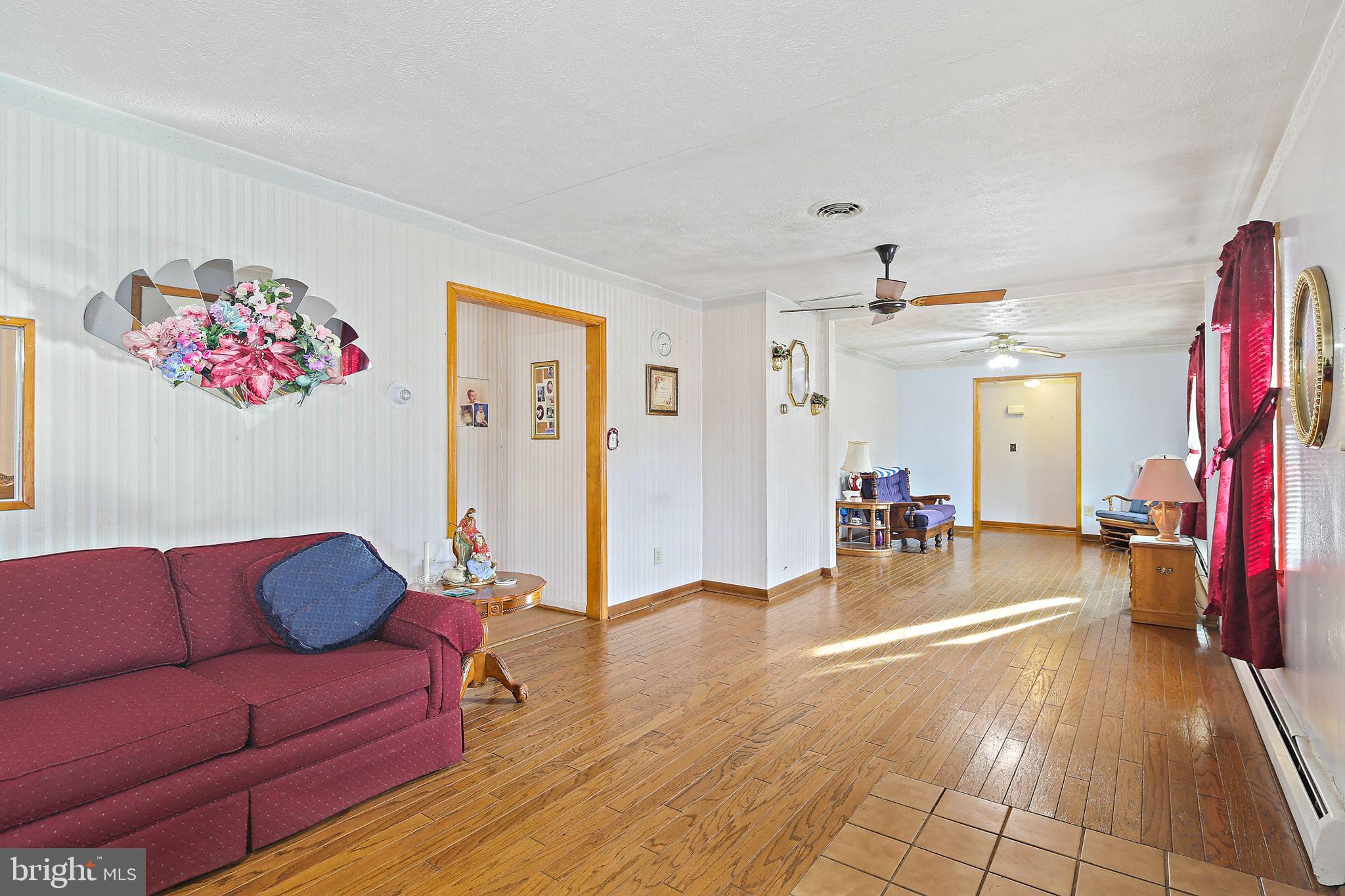 1025 St Michaels Road Mount Airy, MD 21771 - Photo 5 of 31 a living room with furniture and a flat screen tv