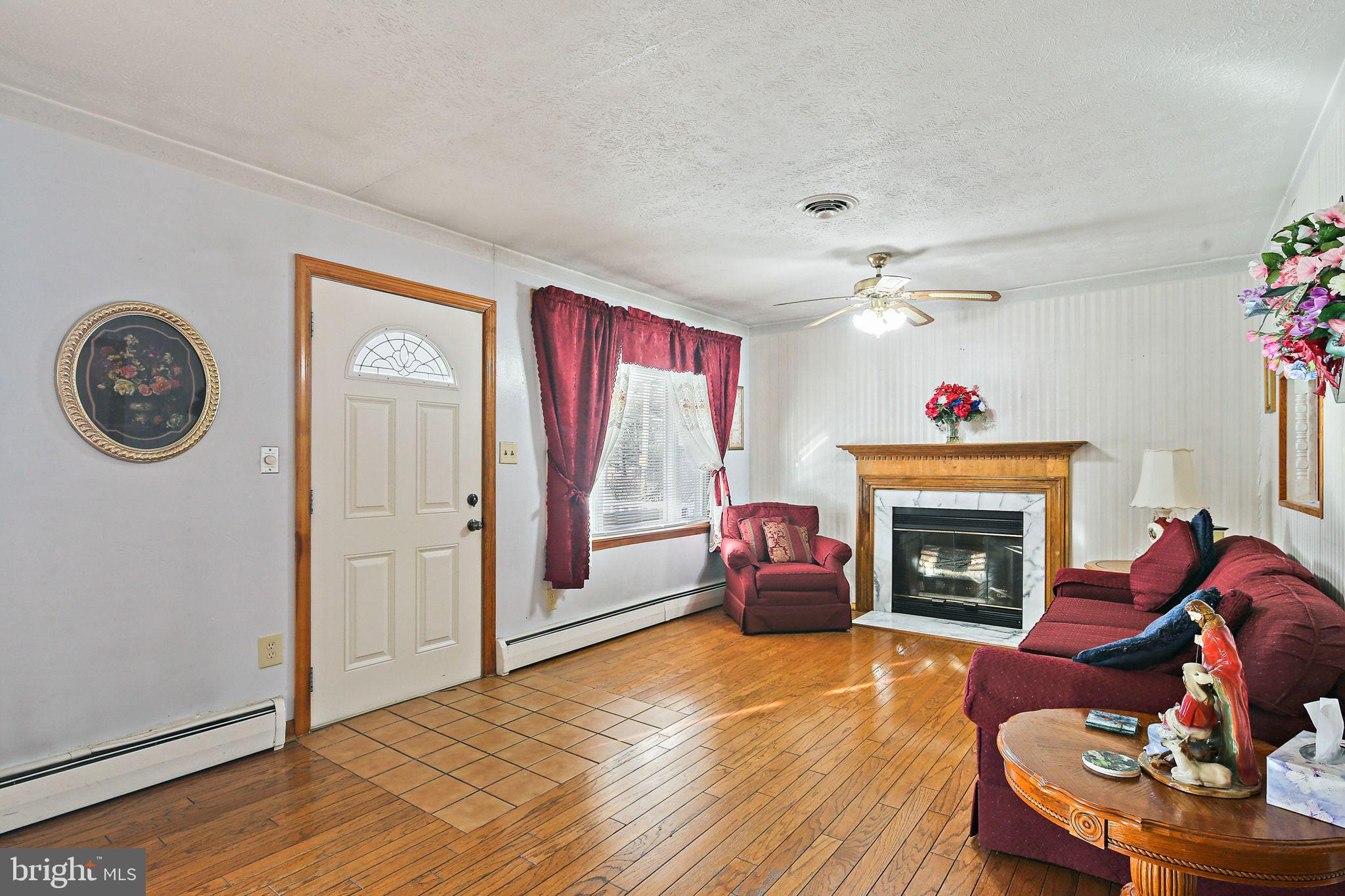 1025 St Michaels Road Mount Airy, MD 21771 - Photo 6 of 31 a living room with furniture and a fireplace