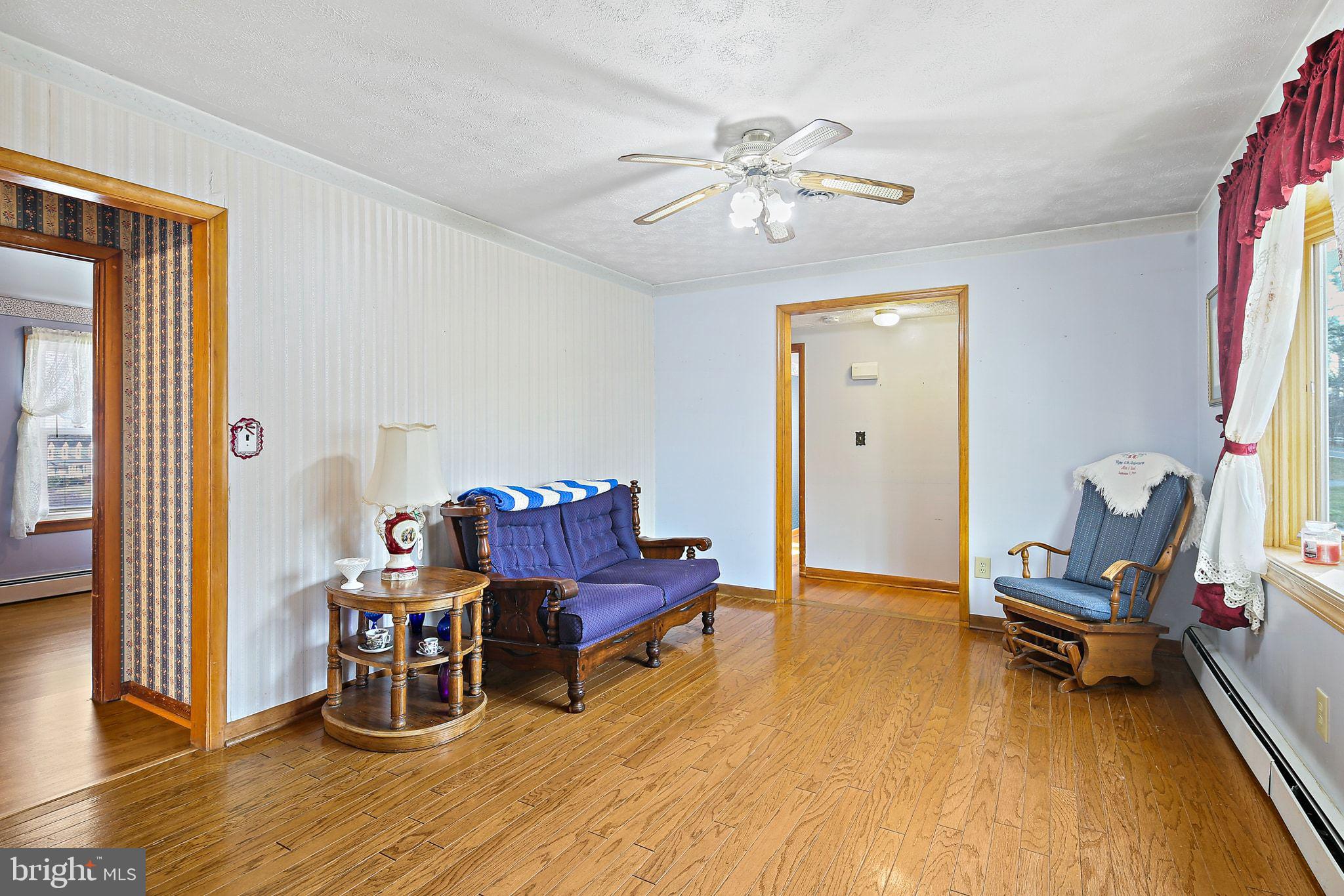 1025 St Michaels Road Mount Airy, MD 21771 - Photo 7 of 31 a living room with furniture and a wooden floor