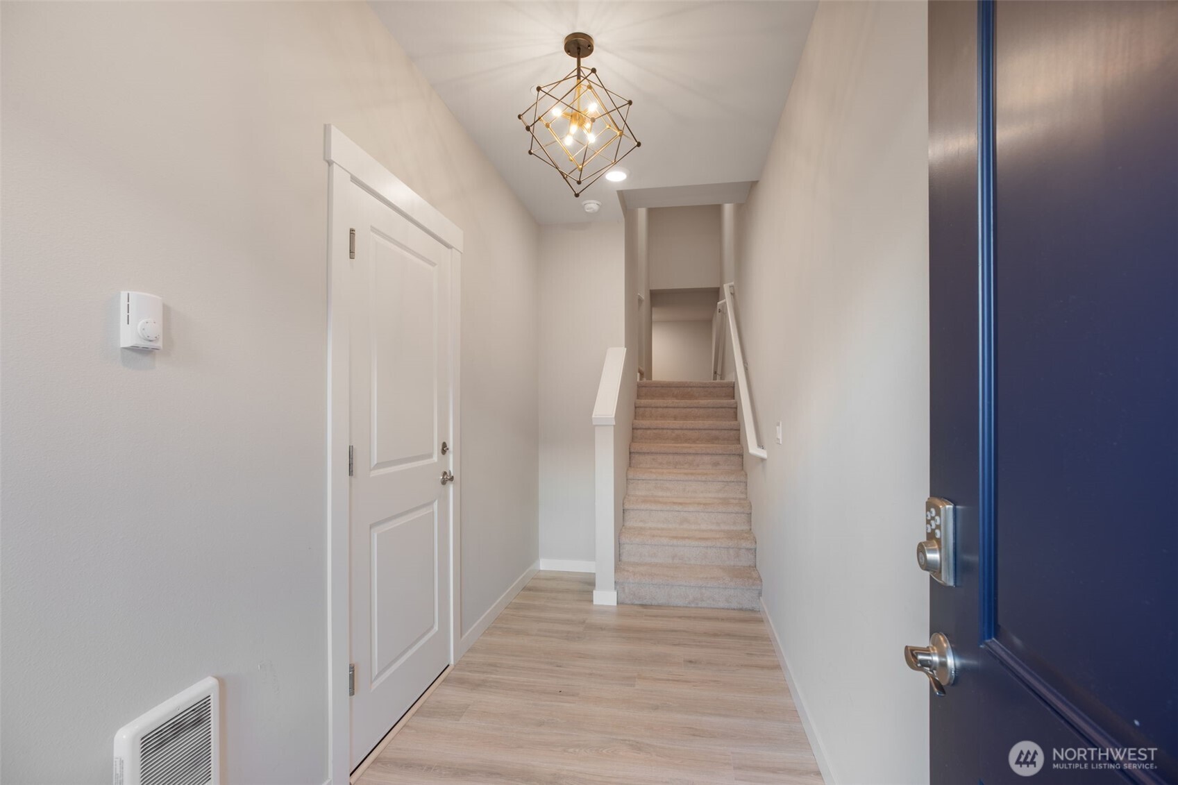 1621 Seattle Hill Road, Unit EE1 Bothell, WA 98012 - Photo 2 of 39 a view of a hallway with wooden floor