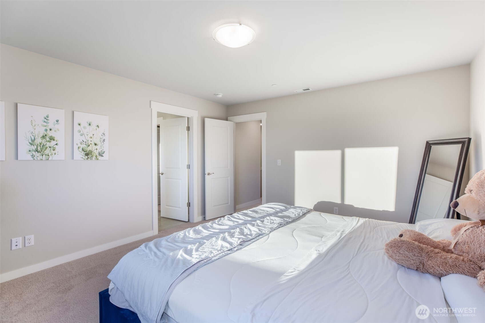 1621 Seattle Hill Road, Unit EE1 Bothell, WA 98012 - Photo 22 of 39 a bedroom with a bed and a mirror