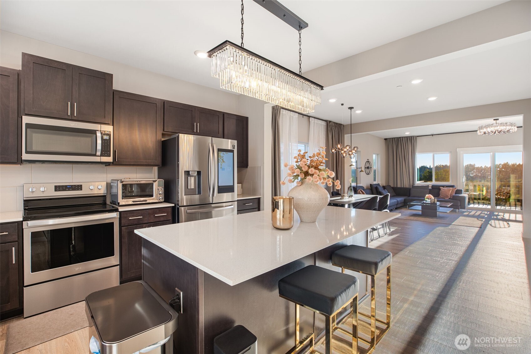 1621 Seattle Hill Road, Unit EE1 Bothell, WA 98012 - Photo 3 of 39 a kitchen with sink refrigerator dining table and chairs