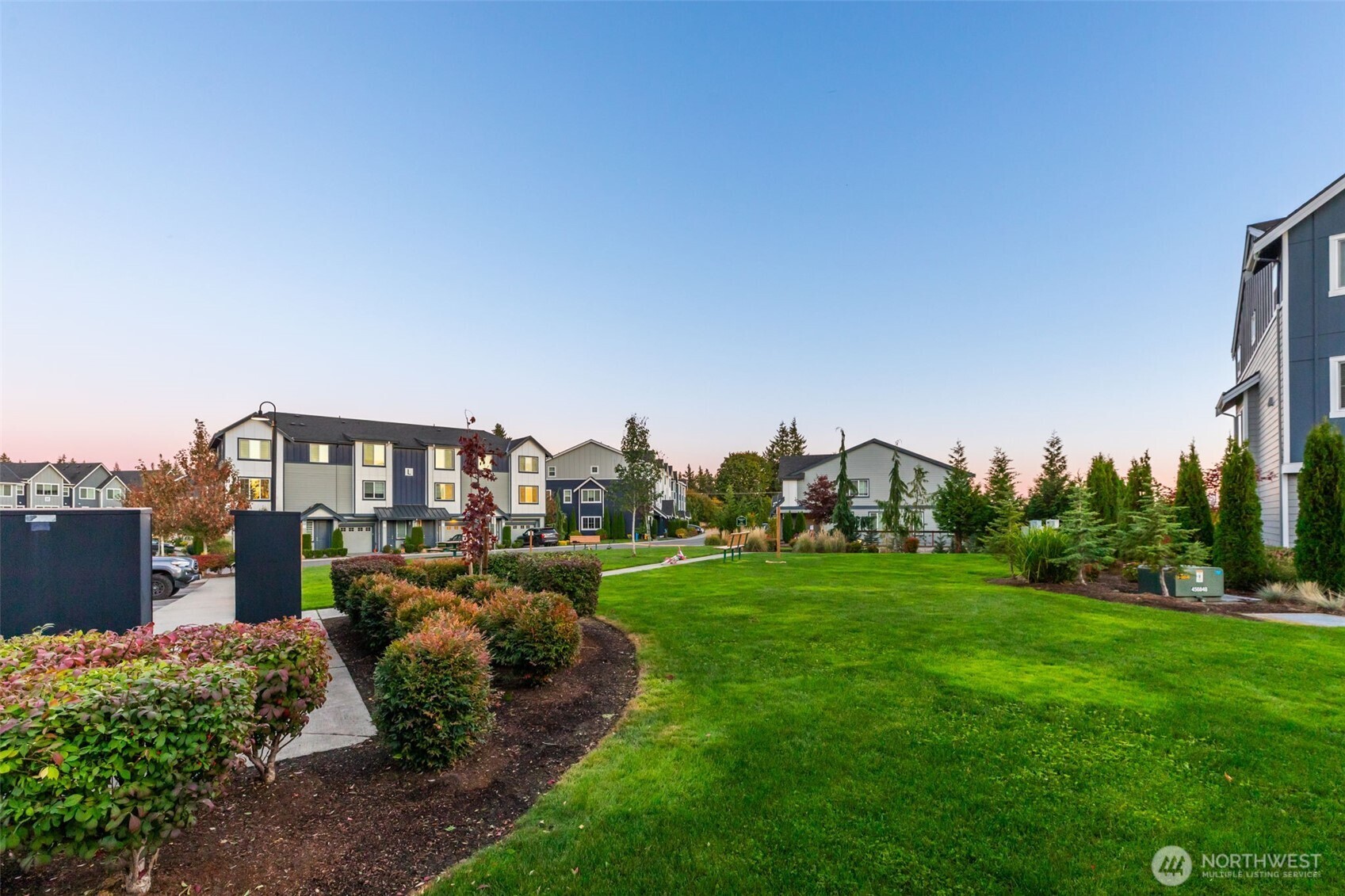 1621 Seattle Hill Road, Unit EE1 Bothell, WA 98012 - Photo 35 of 39 a view of a garden with a building in the background