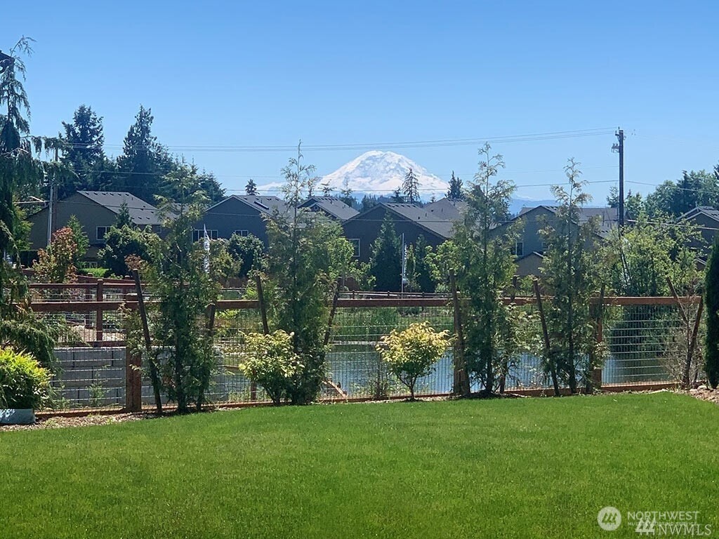 1621 Seattle Hill Road, Unit EE1 Bothell, WA 98012 - Photo 37 of 39 a view of a house with a big yard and a large garden