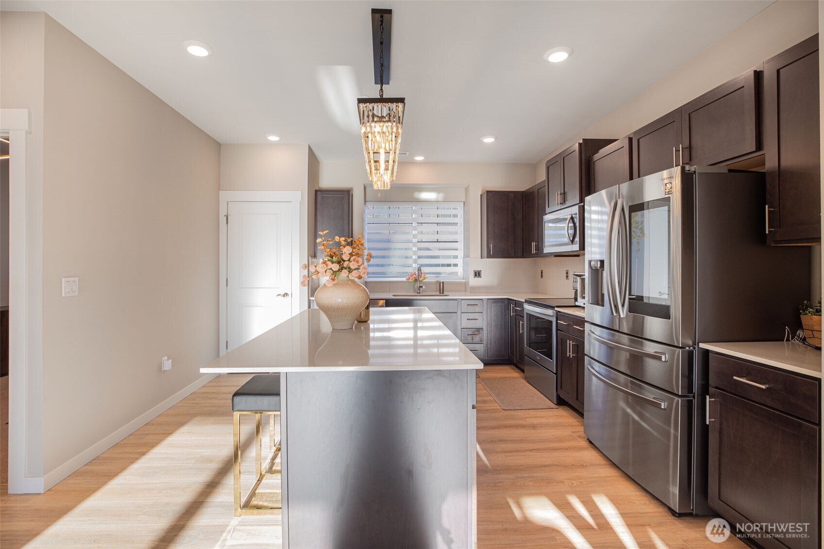 1621 Seattle Hill Road, Unit EE1 Bothell, WA 98012 - Photo 6 of 39 a kitchen with stainless steel appliances a refrigerator sink and stove