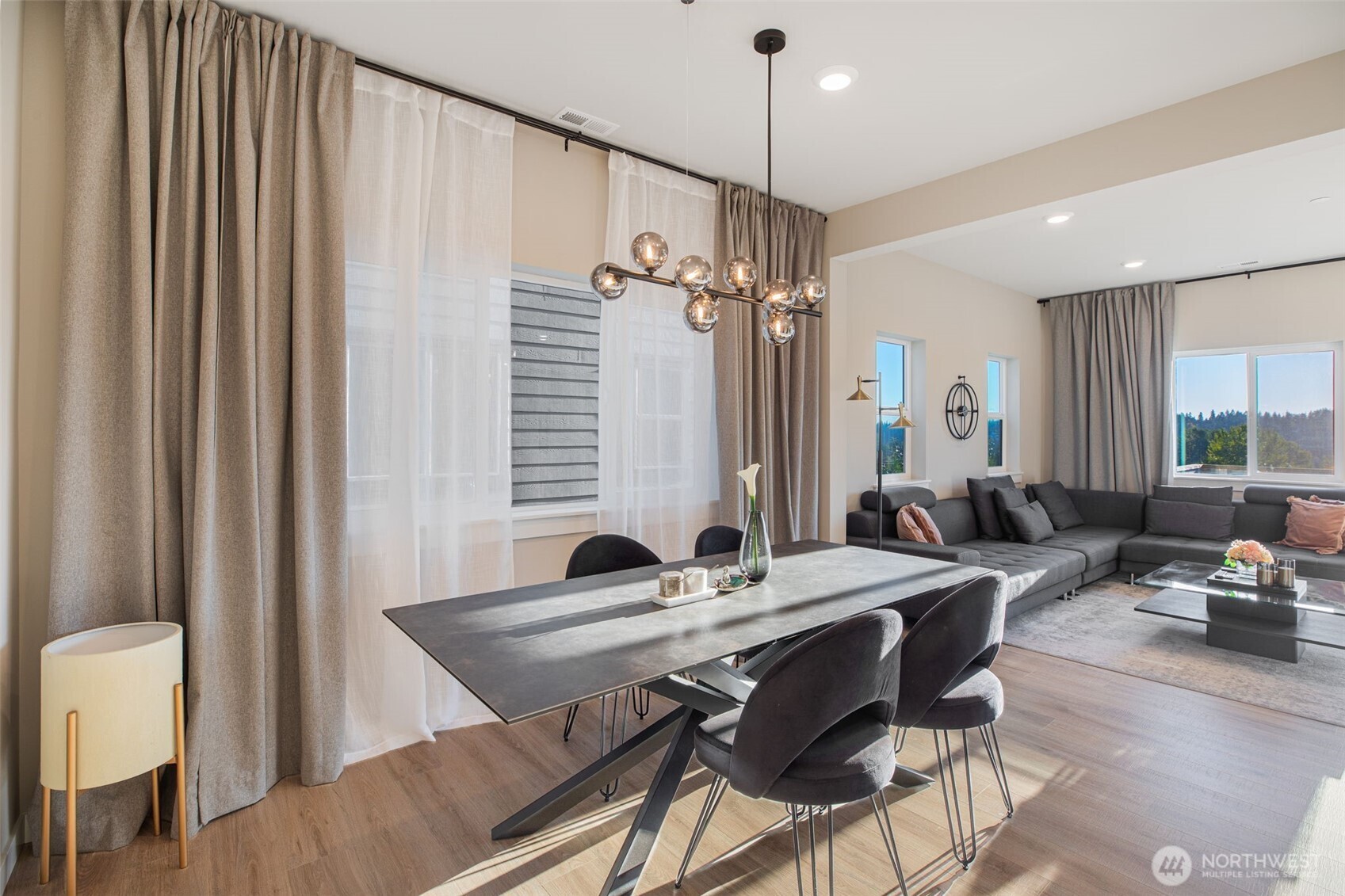 1621 Seattle Hill Road, Unit EE1 Bothell, WA 98012 - Photo 8 of 39 a view of a a dining room with furniture window and wooden floor