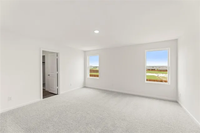 a view of an empty room and a window