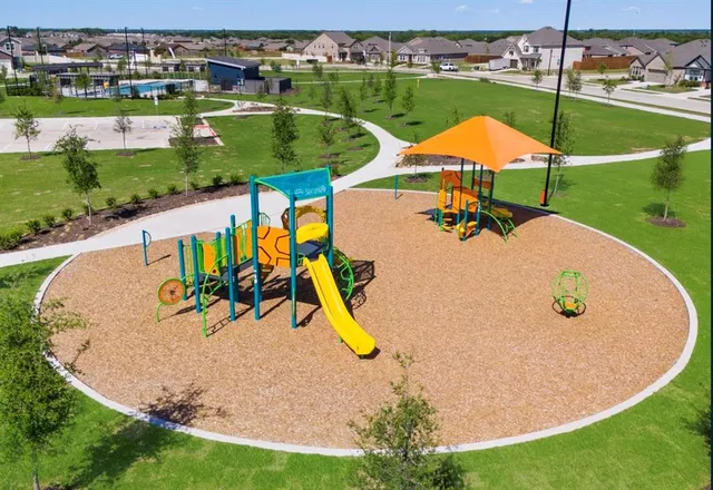 an aerial view of a house with swimming pool patio and outdoor seating