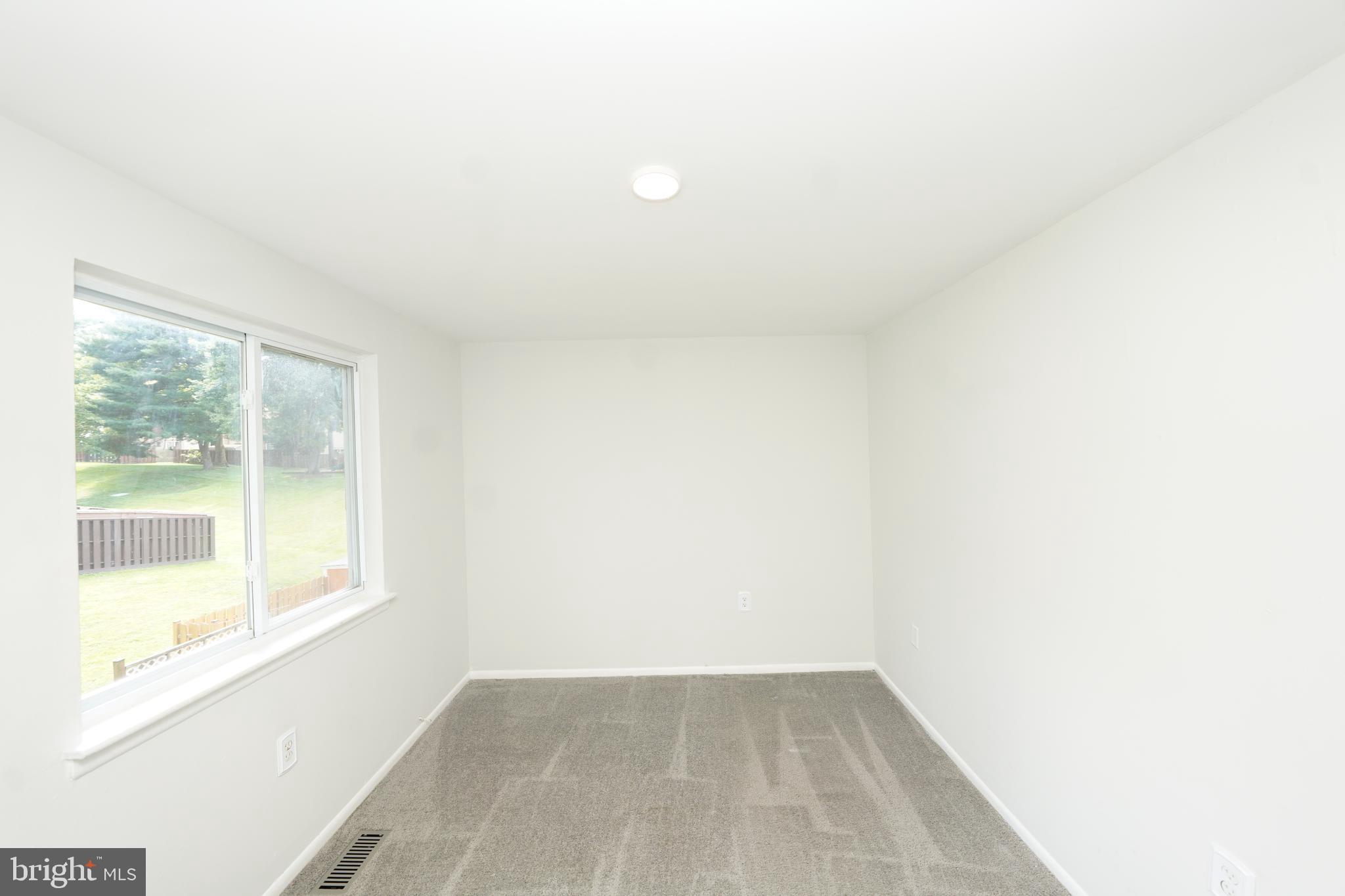 8997 Centerway Road Gaithersburg, MD 20879 - Photo 35 of 71 a view of an empty room with a window
