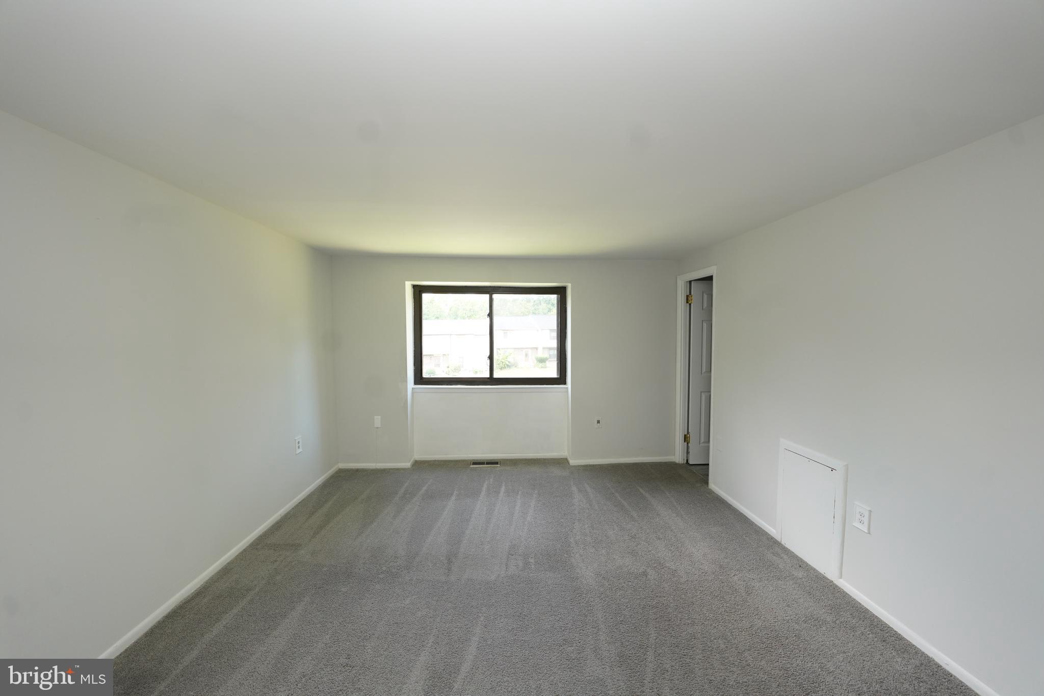 8997 Centerway Road Gaithersburg, MD 20879 - Photo 42 of 71 a view of an empty room with a window