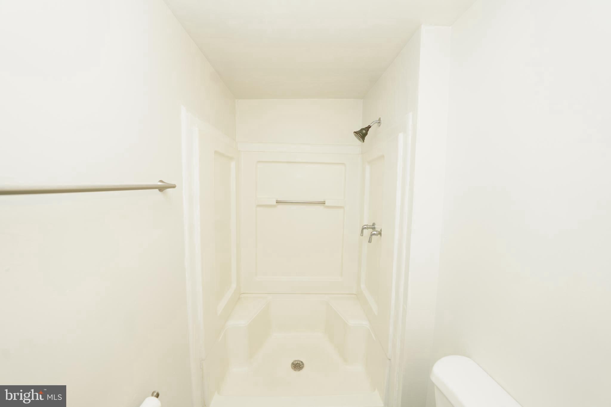 8997 Centerway Road Gaithersburg, MD 20879 - Photo 48 of 71 a bathroom with a shower