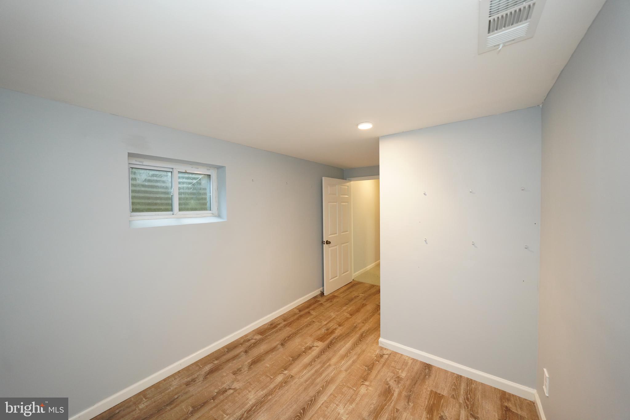 8997 Centerway Road Gaithersburg, MD 20879 - Photo 56 of 71 a view of a big room with wooden floor and windows