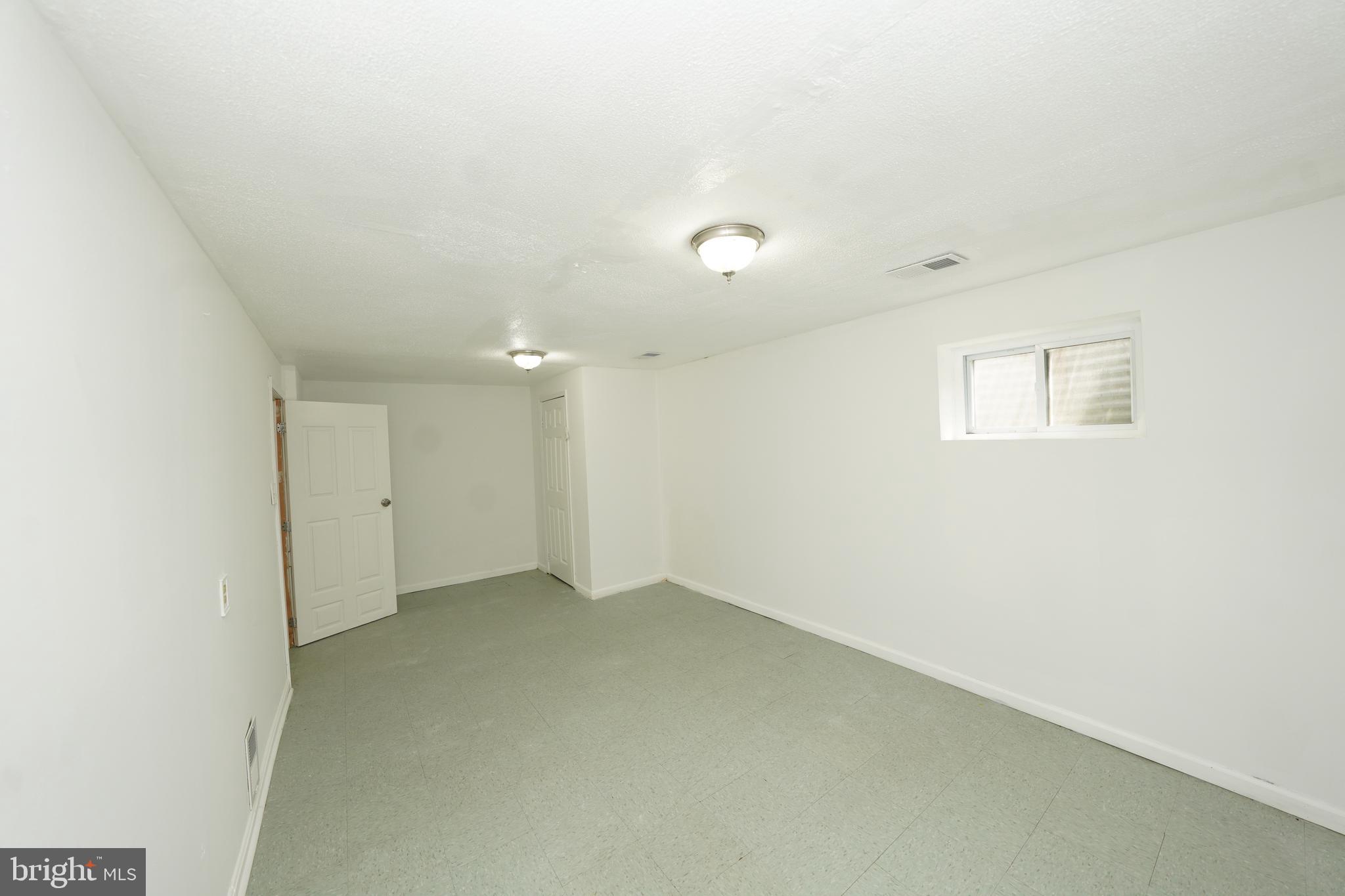8997 Centerway Road Gaithersburg, MD 20879 - Photo 63 of 71 an empty room with a empty space and windows