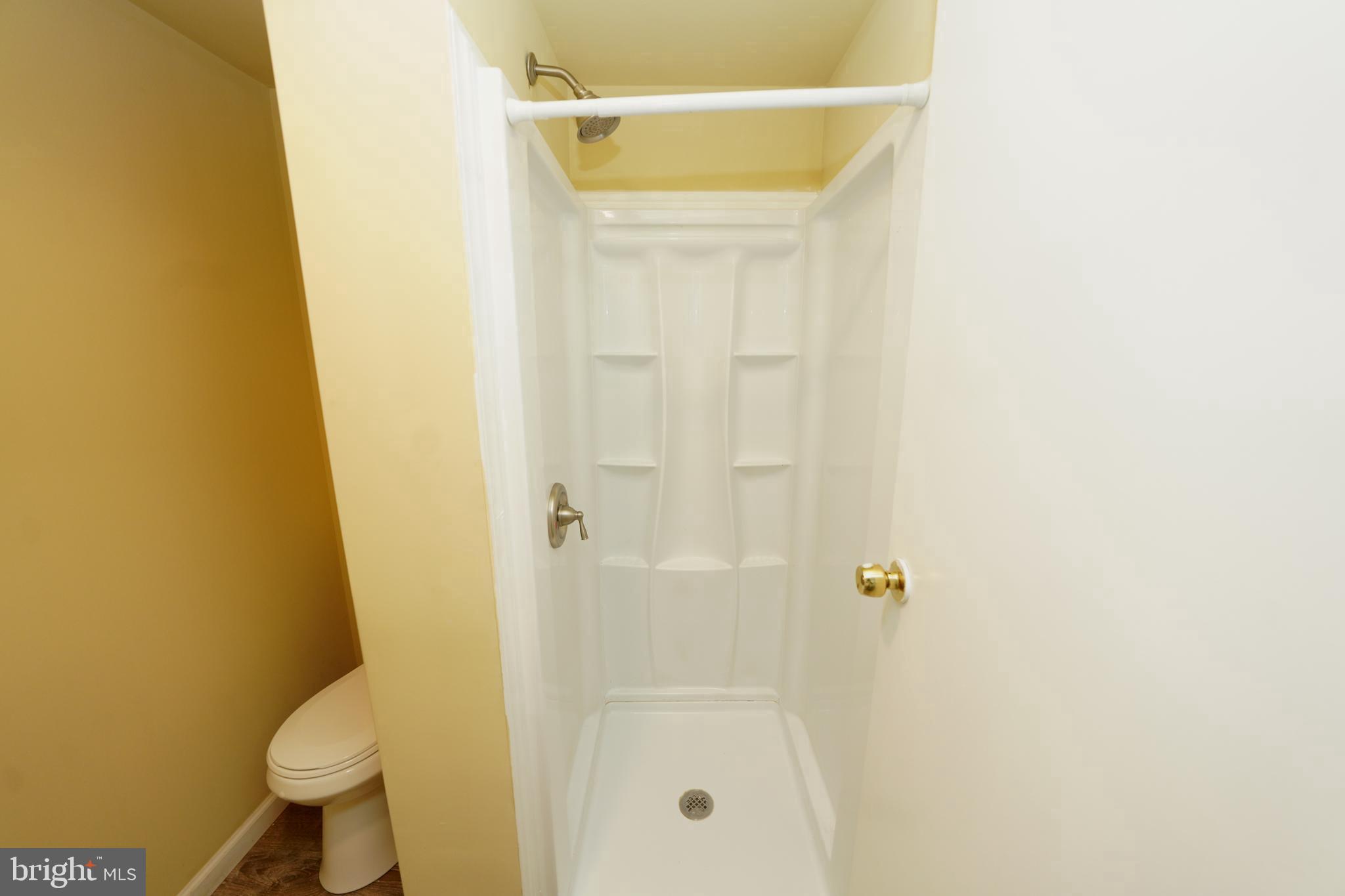 8997 Centerway Road Gaithersburg, MD 20879 - Photo 65 of 71 a bathroom with a shower and a toilet