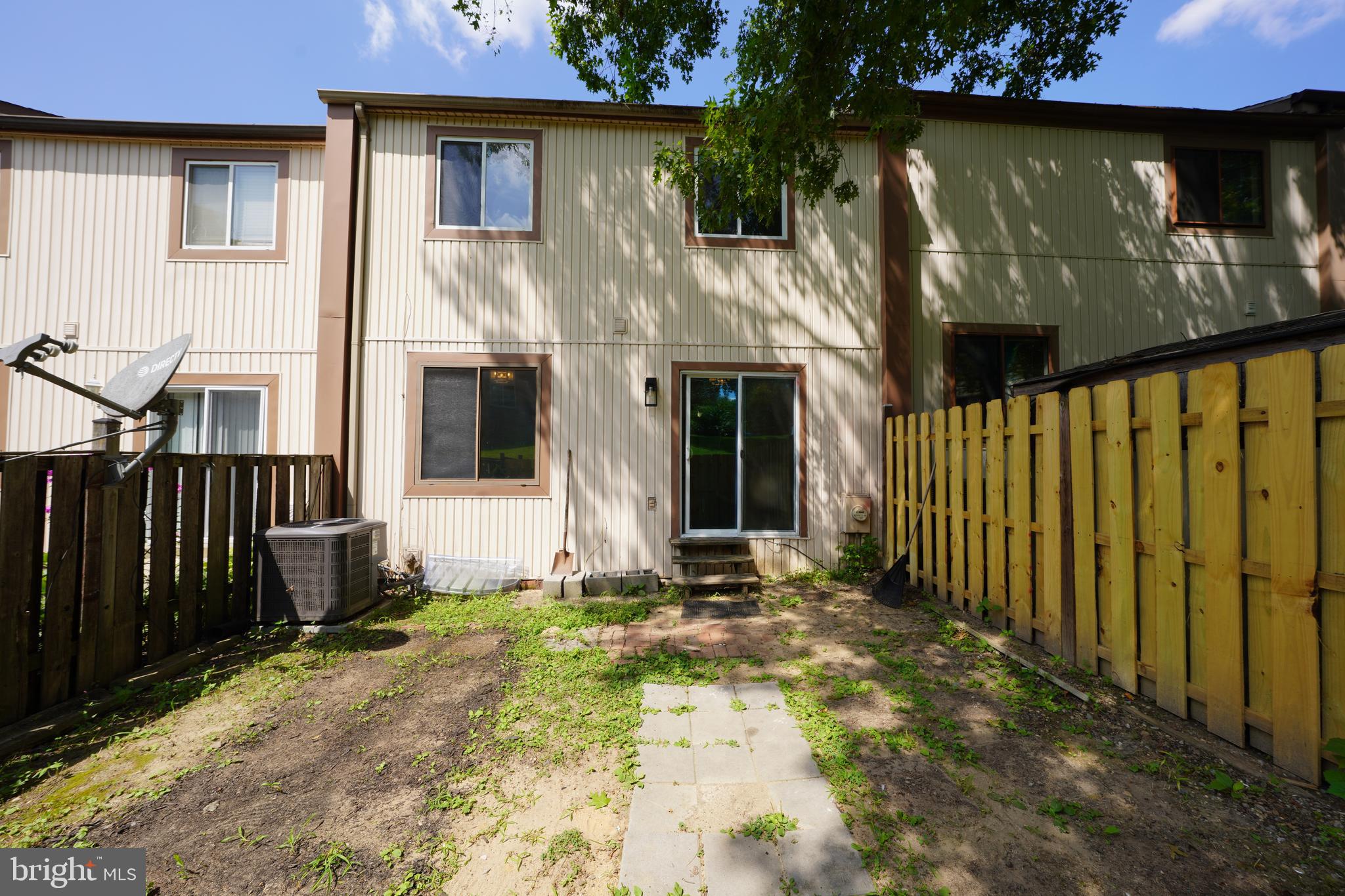 8997 Centerway Road Gaithersburg, MD 20879 - Photo 71 of 71 a front view of a house with a yard
