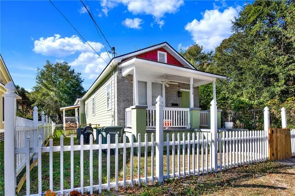 a front view of a house with a porch