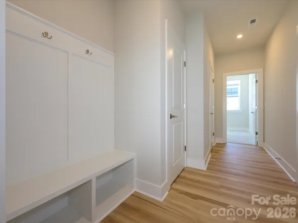 a view of room with wooden floor