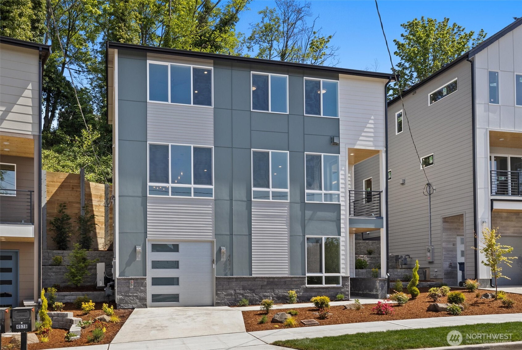 4572 22nd Avenue Southwest Seattle, WA 98106 - Photo 2 of 40 a front view of a building with street view