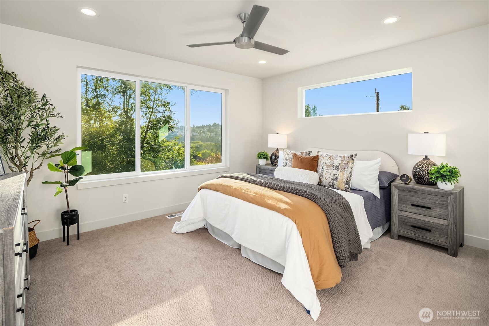 4572 22nd Avenue Southwest Seattle, WA 98106 - Photo 25 of 40 a bedroom with bed and a large window