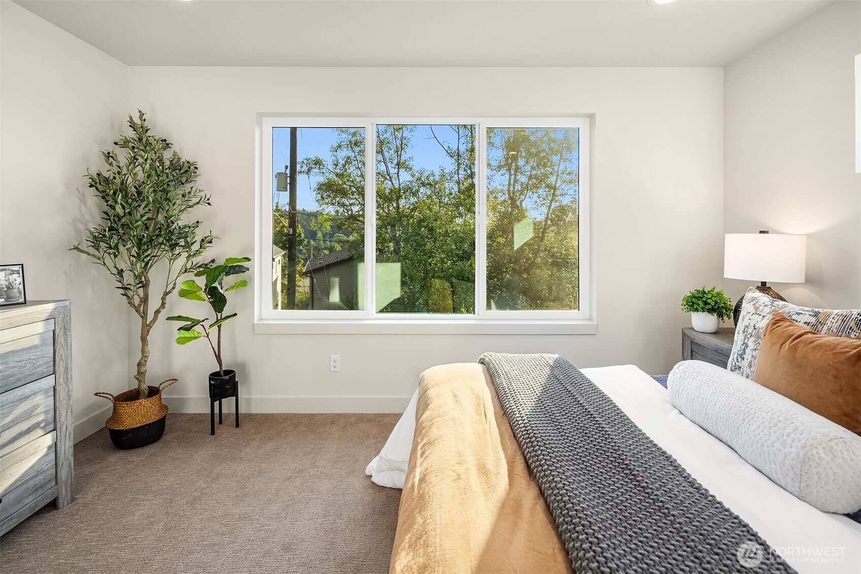 4572 22nd Avenue Southwest Seattle, WA 98106 - Photo 26 of 40 a bedroom with a bed and a window
