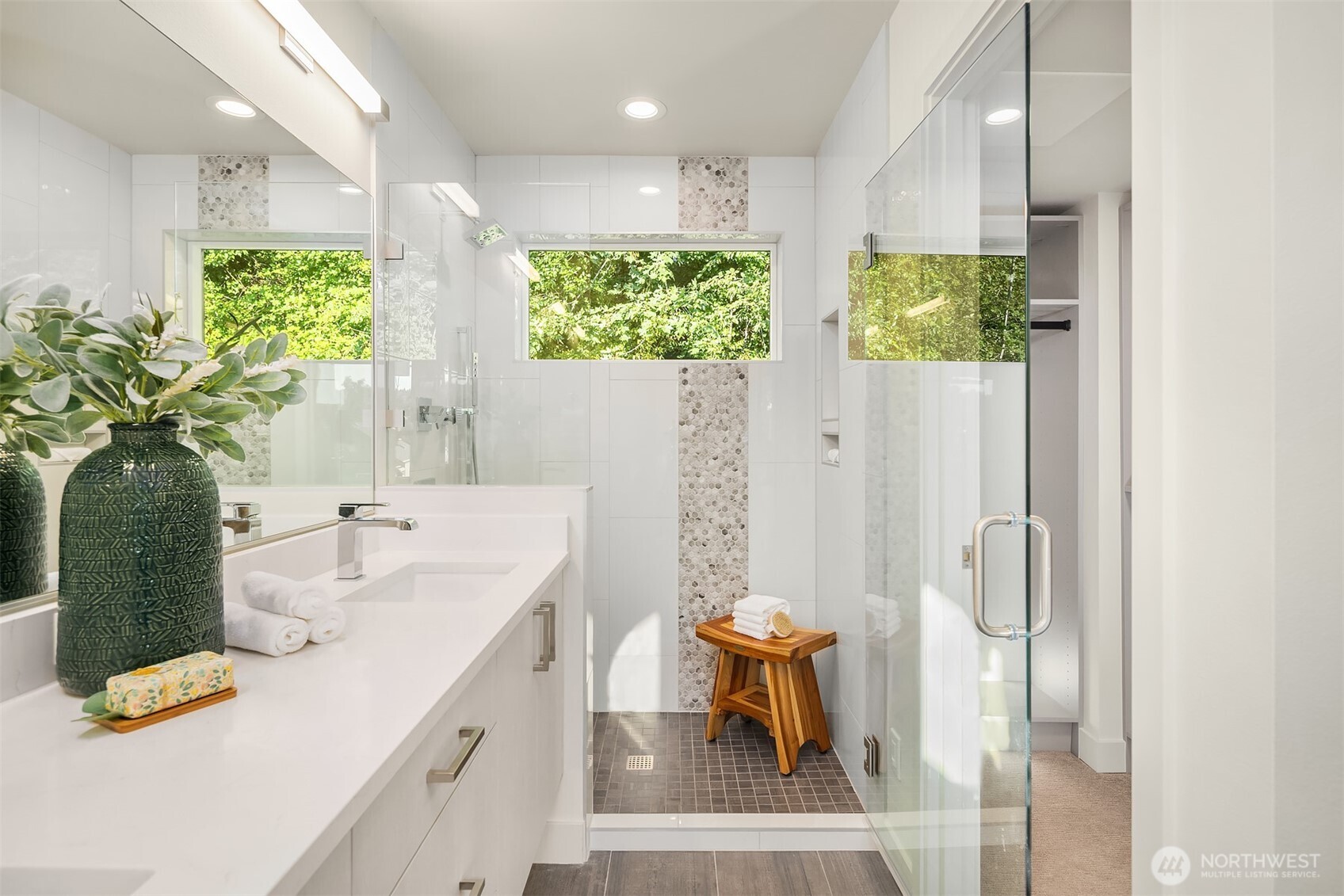 4572 22nd Avenue Southwest Seattle, WA 98106 - Photo 28 of 40 a bathroom with a double vanity sink and a mirror
