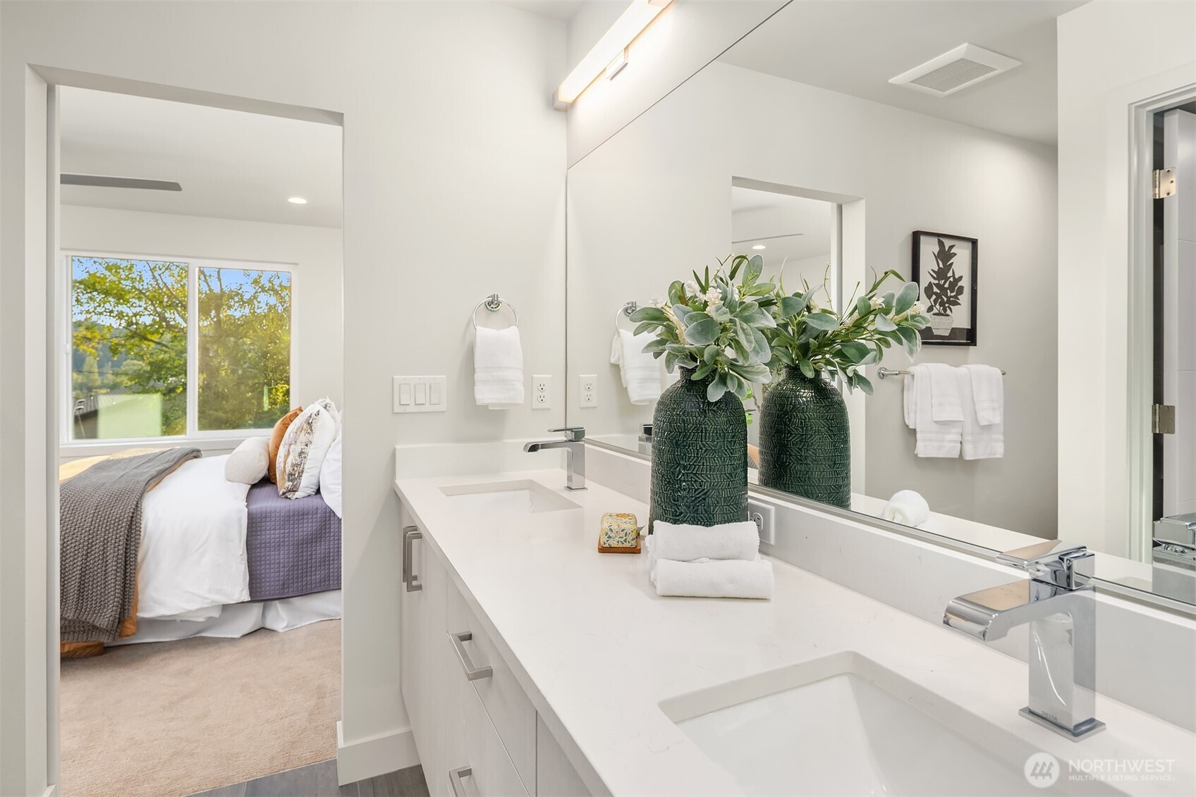 4572 22nd Avenue Southwest Seattle, WA 98106 - Photo 30 of 40 a en suite bathroom with a double vanity sink and mirror