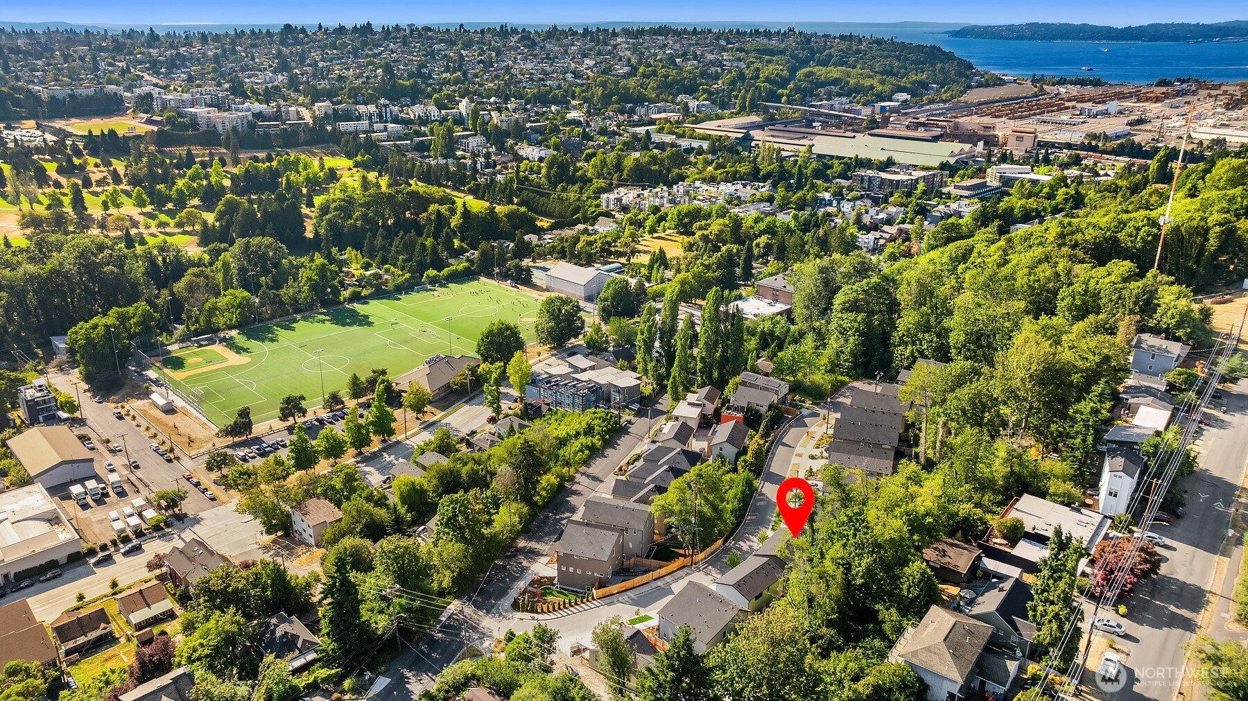 4572 22nd Avenue Southwest Seattle, WA 98106 - Photo 35 of 40 an aerial view of residential houses with outdoor space and trees