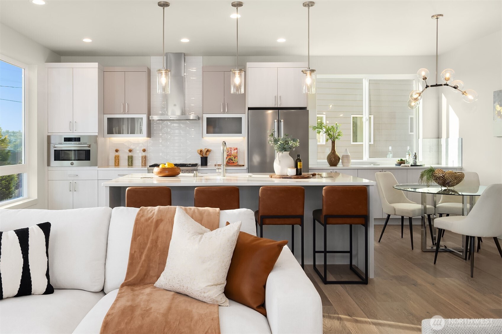 4572 22nd Avenue Southwest Seattle, WA 98106 - Photo 10 of 40 a living room with stainless steel appliances kitchen island granite countertop furniture and a large window