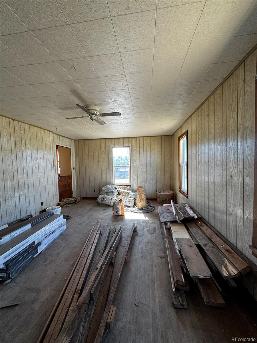 425 5th Street Hugo, CO 80821 - Photo 9 of 13 a spacious bedroom with a bed and a large window