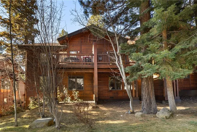 a house with trees in front of it