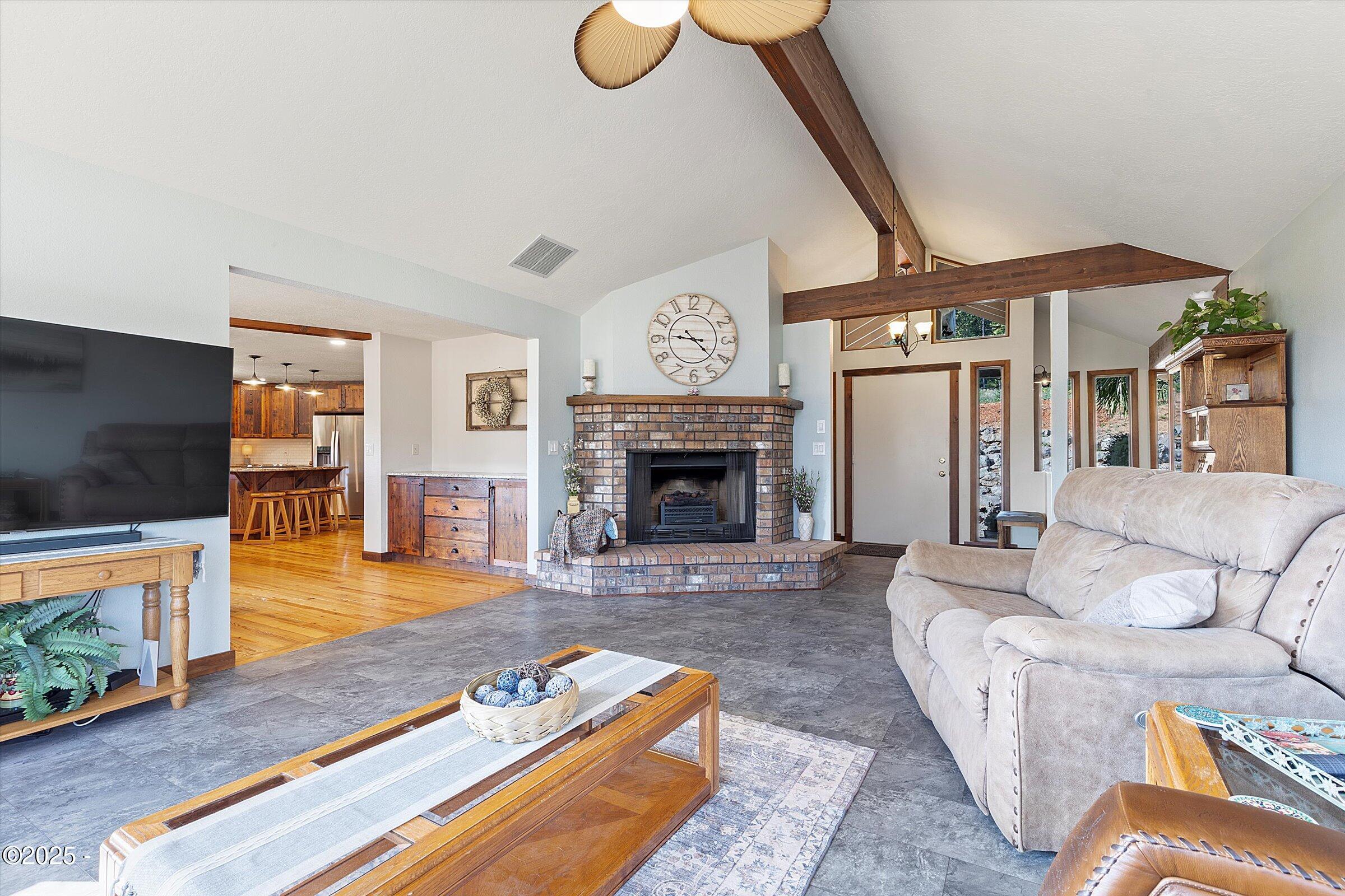 21560 Gooseneck Road Sheridan, OR 97378 - Photo 16 of 63 a living room with furniture and a fireplace