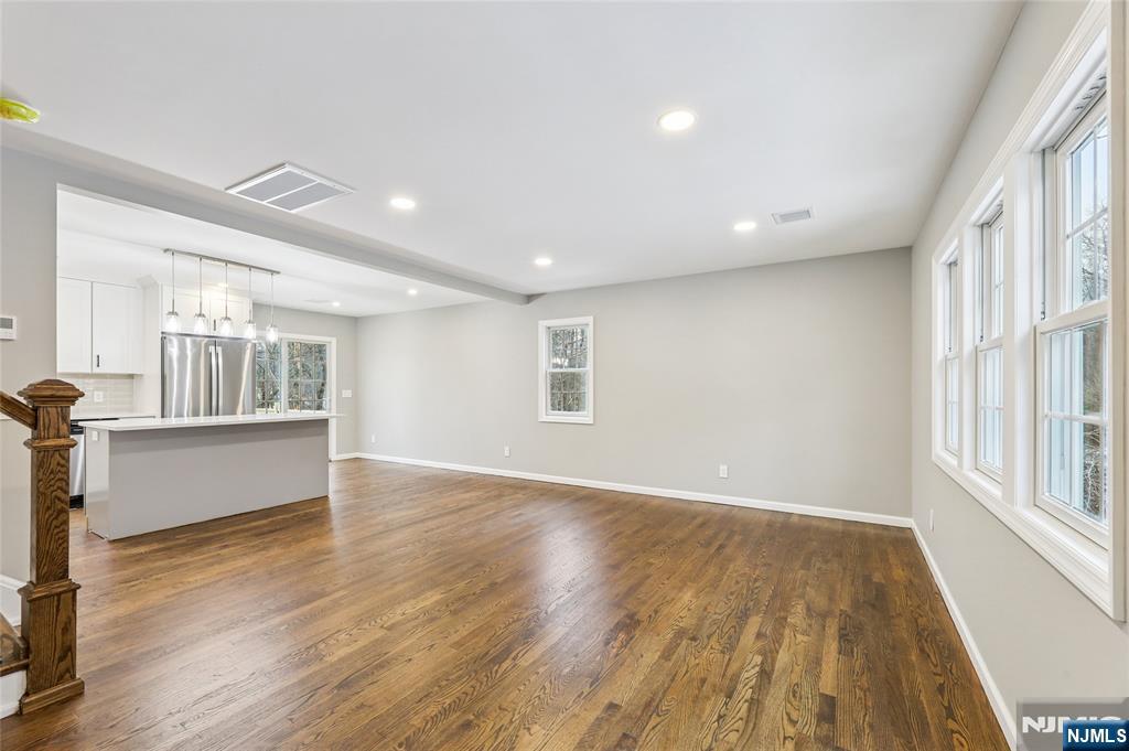 448 Morsetown Road West Milford, NJ 07480 - Photo 11 of 27 a view of empty room with wooden floor and fan